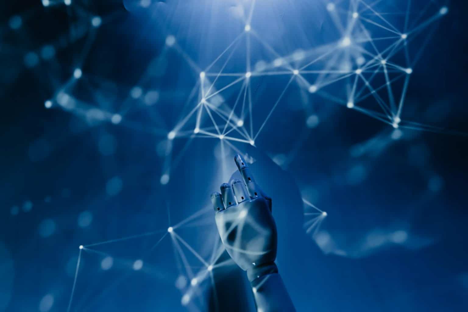 Noua bijuterie medicală din Bistrița: Investiție colosală de 3,5 milioane euro în robotul Da Vinci A robotic hand reaching into a digital network on a blue background, symbolizing AI technology.